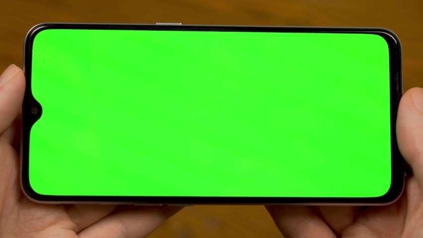 Hands Hold Horizontally Phone Green Screen Stock Footage Video 100 Royalty Free 1067152426 Shutterstock