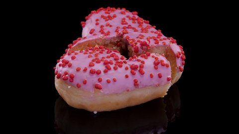 Valentines day, broken bleeding heart concept. Heart shaped doughnuts. Heart shaped food.