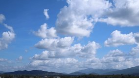 Time lapse. White and gray clouds swim quickly and change shape. Puffy fluffy soft clouds. Dramatic cloudscape timelapse. Summer. Majestic amazing blue sky.