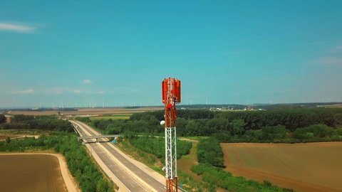 TV Tower with Antennas. Aerial drone view of tower antennas Telecommunication cell phone, radio transmitters of cellular 5g 4g mobile and smartphones. Communication and TV broadcasting on blue sky