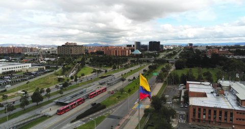 Aerial view of giant Colombian flag in Bogota, Colombia, landscape circle pan