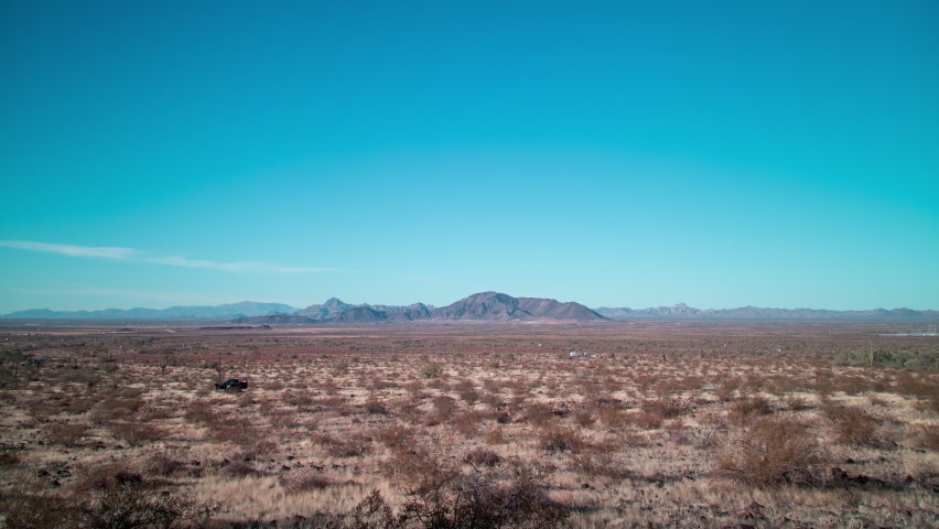 A sunset time-lapse of Burnt Mountain in the Sonoran Desert near Tonopah, Arizona. Interstate 10 and the Big Horn Mountain and Hummingbird Springs Wilderness areas are seen in the distance.