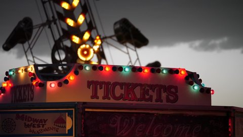 Fun carnival rides with bright flashing lights at night
