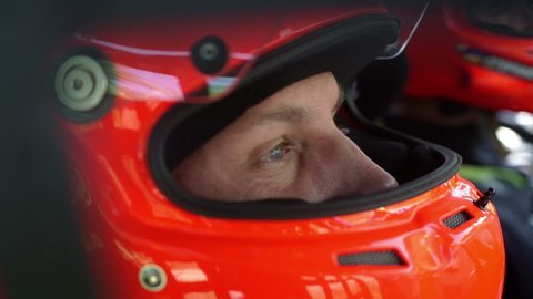 Sumy, Ukraine 06.21.2020 Race Driver Waiting for Race close up. Man on Race Helmet. Professional driver on Race Helmet.