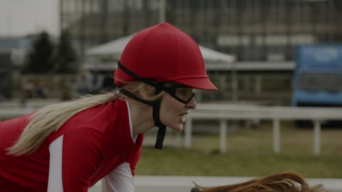 Jockey Sportswoman Riding Horse in Race Close-up