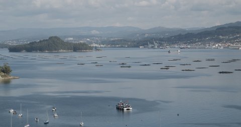 Panoramic view of Ria de Pontevedra, Galicia, Spain and and Marin harbor at background on sunny day. Beautiful seascape of Galicia