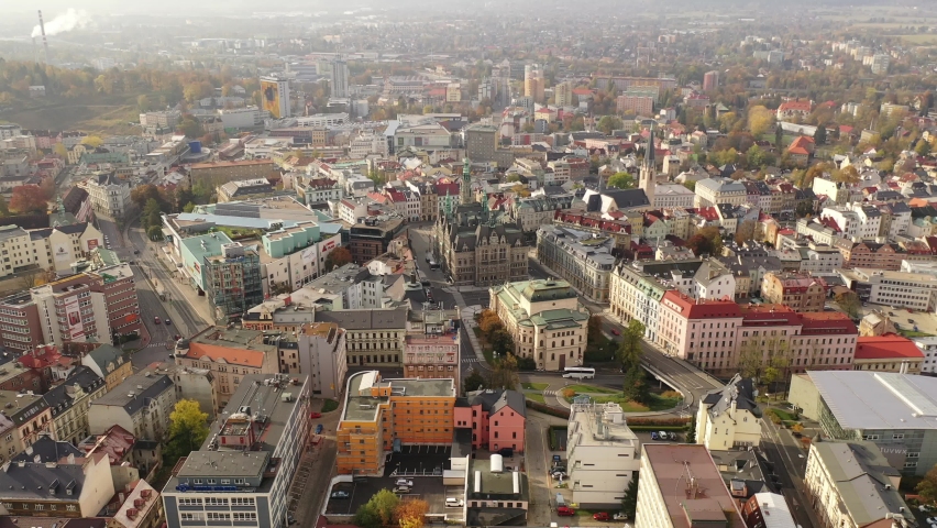 Aerial view of residential districts of Liberec city and grandiose building of Town Hall in autumn day, Czech Republic