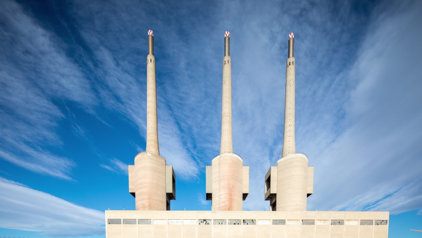 Forward and reverse fast timelapse of the iconic three chimneys disused power station on the outskirts of barcelona, spain 