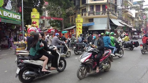 Hanoi, Vietnam - 2021: Hanoi's people go to shop for Lunar New Year.