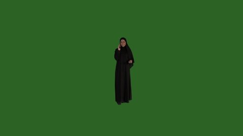 Green screen Arab Saudi woman talking on her phone, talking on cellphone on a green screen, middle eastern woman on green screen, KSA woman with green screen background, mobile, cellphone