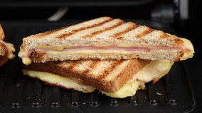 sandwich with cheese and ham on grill. grilled cheese sandwich close up - Powered by Shutterstock - Get 15% off with code: PIKWIZARD15