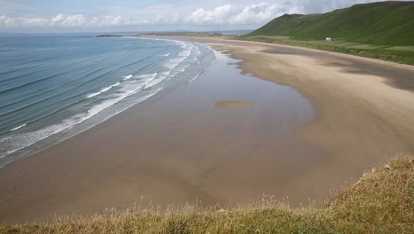 Rhossili beach one of the best beaches in the UK on The Gower peninsula near South Wales  Royalty-Free Stock Footage #10672007