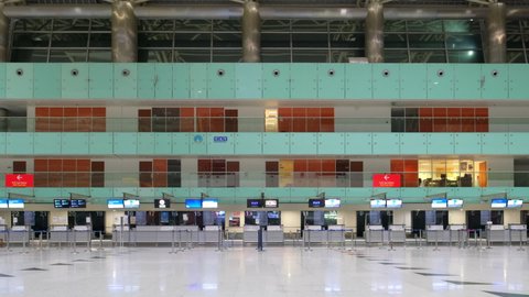 Izmir, Turkey - December 6, 2020: Empty check-in area in Izmir Adnan Menderes Airport during Covid-19 coronavirus pandemic. Only few flights per day left during pandemic times