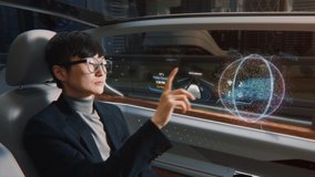 Futuristic Concept: Stylish Japanese Businessman Checking Arrival Location on an Interactive Augmented Reality 3D Navigation App while Sitting in on the Back Seat of an Autonomous Self-Driving Car. - Powered by Shutterstock - Get 15% off with code: PIKWIZARD15