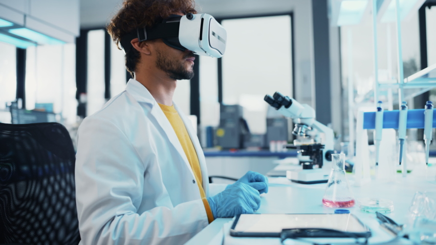 Futuristic Medical Science Research Laboratory: Bioengineer Wearing Virtual Reality Headset, Does Augmented Reality Research Using Smart Gestures. DNA Chain Biotechnology Research in Progress. Royalty-Free Stock Footage #1067208079