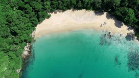 Aerial view Drone camera top down of seashore rocks in a blue ocean. Sea waves on beautiful seascape aerial view drone 4k High quality of ocean waves crashing against an empty stone rock cliff