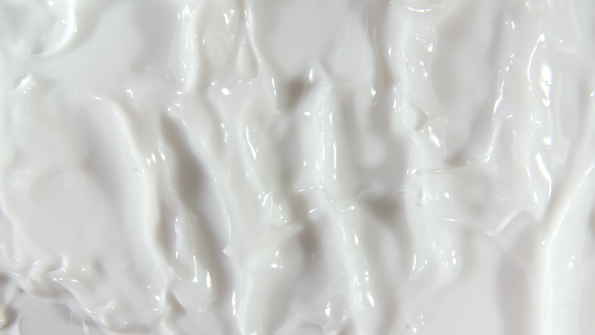 Motion of the Liquid cream, white cosmetic texture with rotation. Contouring, Make up smears background. Organic cosmetics, medicine. Top view. 4K UHD video | Shutterstock HD Video #1067230171