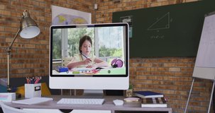Caucasian schoolgirl learning displayed on computer screen during video call. Online education staying at home in self isolation during quarantine lockdown.