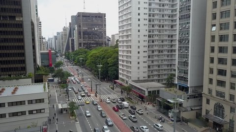 cars and people traffic at paulista avenue sao paulo brazil 2021 during pandemic 
