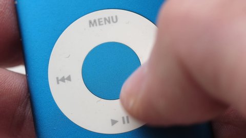 Click wheel of an iPod music player close-up shot of the finger sliding on the wheel MONTREAL CANADA FEBRUARY 2021