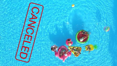 AERIAL, TOP DOWN: Awesome summer pool parties get canceled this year due to the global covid-19 pandemic. Playful friends will have to postpone their summer poolside parties because of coronavirus.