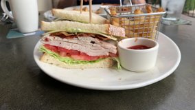 Zooming in on a Turkey Club Sandwich