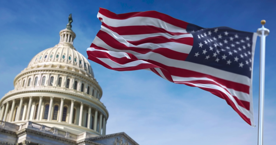 American flag waving with the US Capitol Hill blurred in the background Royalty-Free Stock Footage #1067248417