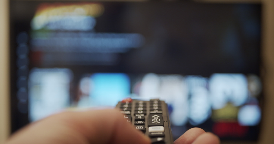 Using smart tv remote control for streaming and watching videos on modern television