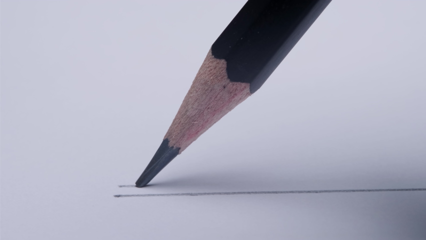 drawing parallel line gray by graphite wooden pencil on white paper background, close-up macro shot Royalty-Free Stock Footage #1067258887