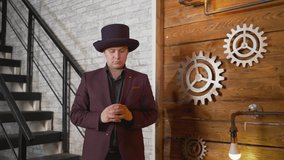 The magician shows trick with a light bulb. Magical lighting of a light bulb. Businessman demonstrating magic. Magician at work. Entertainer performing magic tricks with light bulb. - Powered by Shutterstock - Get 15% off with code: PIKWIZARD15