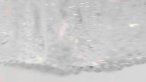 close-up pouring soda into the glass with ice. Food background. Cold beverage. 4K UHD video 3840x2160 