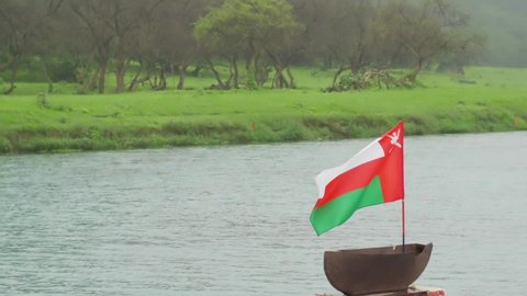 The Sultanate of Oman flag waving on the outskirts of Darbat Falls.

Wadi Darbat is the most beautiful and spectacular place in Salalah city and the perfect place for mountain and nature lovers.  