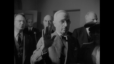 1940s: Swearing in of Harry S. Truman as President by Chief Justice Harlan F. Stone. Bess Truman watches the Inauguration.