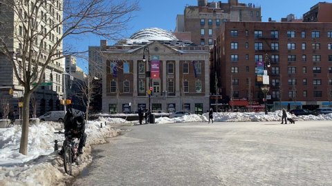 New York, NY, USA - Feb 12, 2021: Sunny winter day after snow storm and plowing at northern edge of Union Square