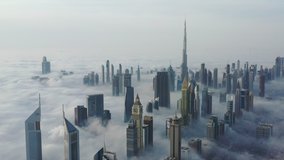 Aerial birds eye view of Dubai city urban futuristic skyline during fog - Powered by Shutterstock - Get 15% off with code: PIKWIZARD15