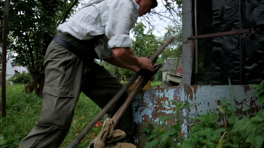 The man takes a shovel, a pickaxe and goes in search of gold, treasures and jewels in the mountains.