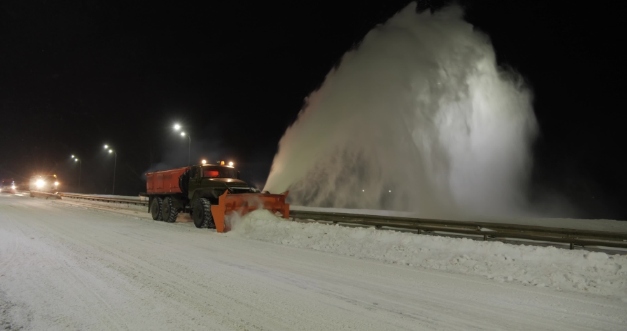 Grader clean remove snow, snowplow.