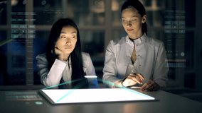 A group of scientists performs calculations using holographic projection. The Concept of Digitalization of Information, data visualization. Artificial neural network and Machine learning - Powered by Shutterstock - Get 15% off with code: PIKWIZARD15