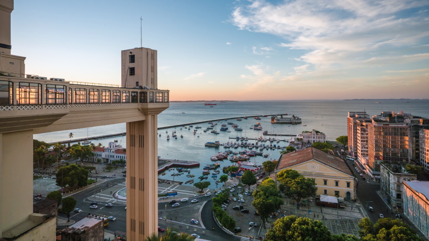 Salvador, Bahia, Brazil, day to night timelapse view of Salvador cityscape including architectural landmark Lacerda lift (Portuguese: Elevador Lacerda) during summer.