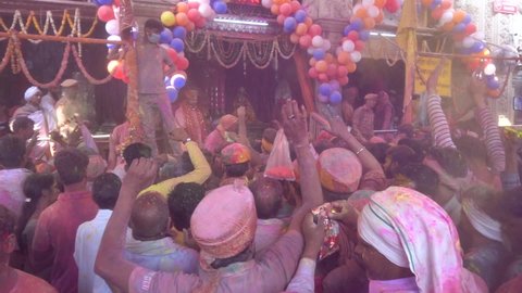 People celebrating holi festival with colors. holi is a festival of India. It is festival of colors and Joy. It is also called as Dhuleti. Barsana, Uttar Pradesh, India - March 4th 2020