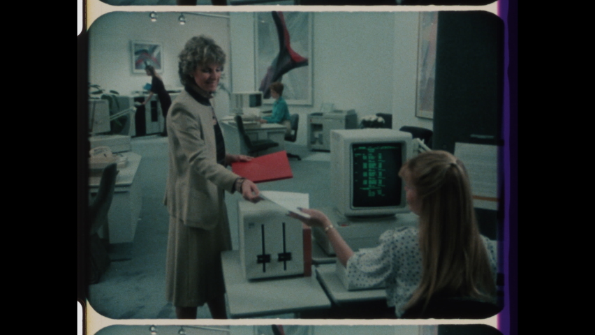 1980s Armonk, NY. Vintage Computer Technology, Rapid Montage of Fingers Typing on Keyboard, Desktop Computer Screen, Oversized Printer, Two Men working on Vintage Computer. 4K Overscan of 16mm Film