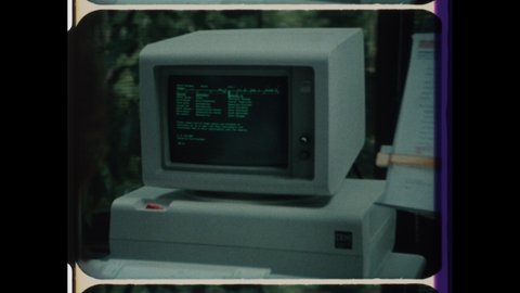 1980s Armonk, NY. Vintage Computer Technology, Rapid Montage of Fingers Typing on Keyboard, Zoom in On IBM Computer, Women working on Desktop Computers. 4K Overscan of 16mm Archival Film Print