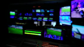 Newsroom Background for News Broadcasts. Professional sound engineer's console. Television Broadcast, working with video and audio mixer, control broadcast in recording studio. blurred background.