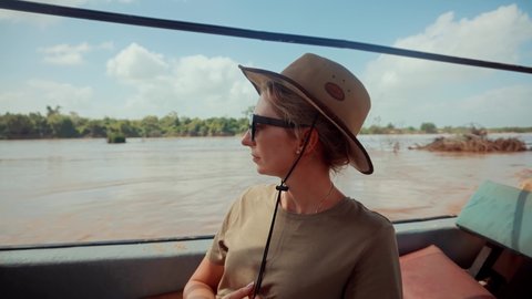 Wild Nature Of Search Crocodile , Hippos Serengeti Or Ngorongoro. Woman On Africa River Safari Adventure. Safari Trip On Tanzania Selous. Tourist In Hat On African Safari Adventure On Holiday Vacation