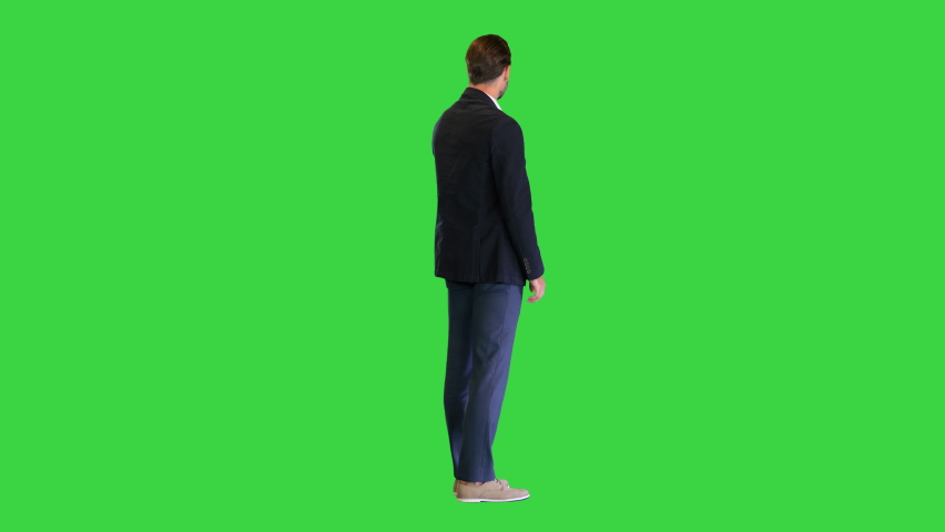 Business man waiting and using a smart watch to check message on a Green Screen, Chroma Key. | Shutterstock HD Video #1067343610