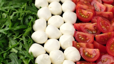 caprese salad. ingrediens for Italian salad caprese as Italian flag. Healthy food concept