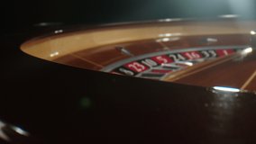 Casino roulette in motion. White ball drops to number 29 while the wheel spinning. The Roulette Table in the Casino.