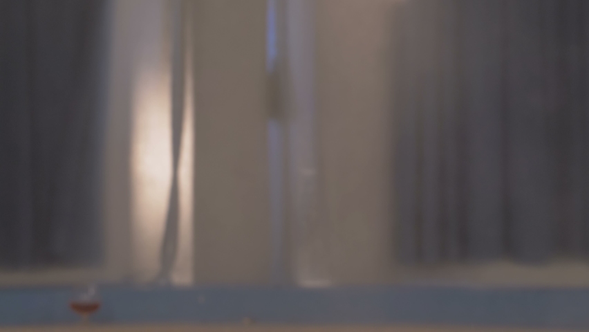 Back view of beautiful woman entering pool at spa center