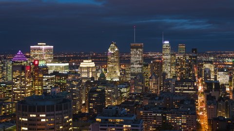 Montreal, Quebec, Canada, night timelapse view of Montreal skyline showing modern office buildings in the financial district. 