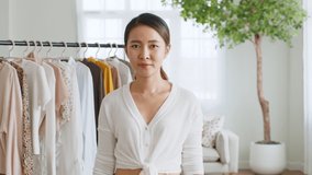 POV Asian woman influencer seller broadcast live streaming to sell clothes for online social marketing